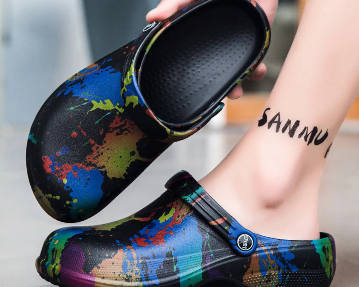 NEWYORKLISTED STYLE COLLECTION: Colorful splatter-patterned clogs being worn with a blurred background