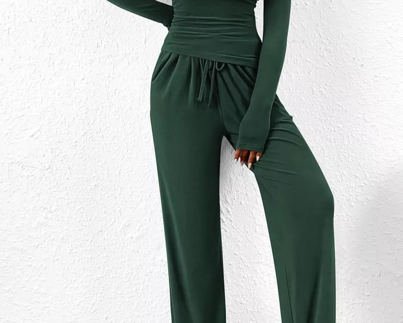 NEWYORKLISTED COMFORT COLLECTION: Long Sleeve Top and Wide Leg Pants Set: Green jumpsuit worn by a person against a white wall