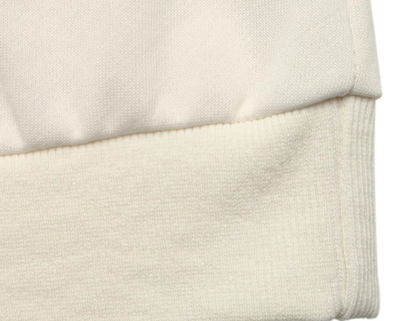 NEWYORKLISTED STYLE COLLECTION: Close-up of a beige fabric texture on a white background