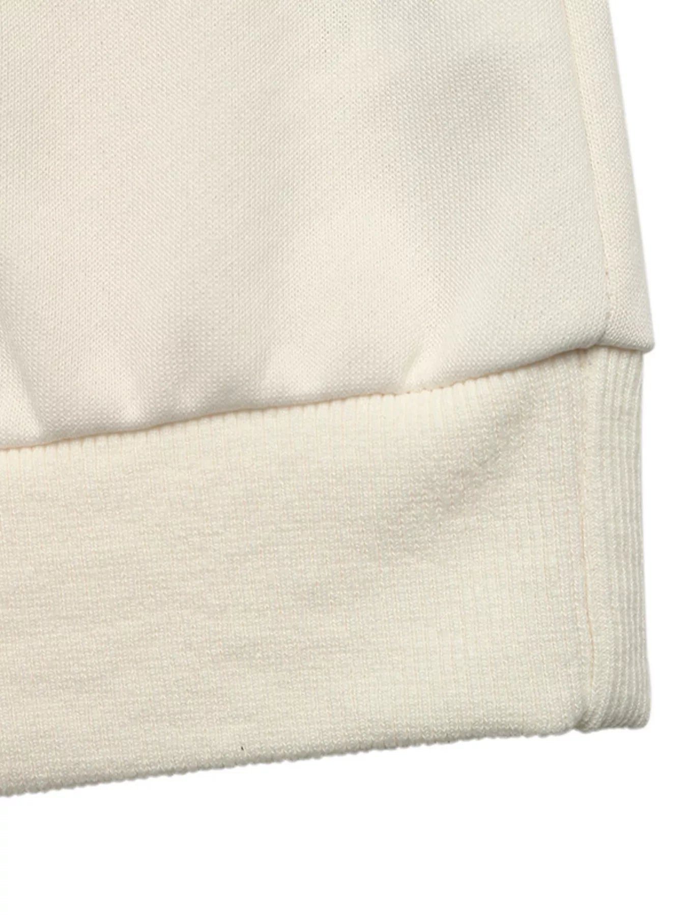 NEWYORKLISTED STYLE COLLECTION: Close-up of a beige fabric texture on a white background