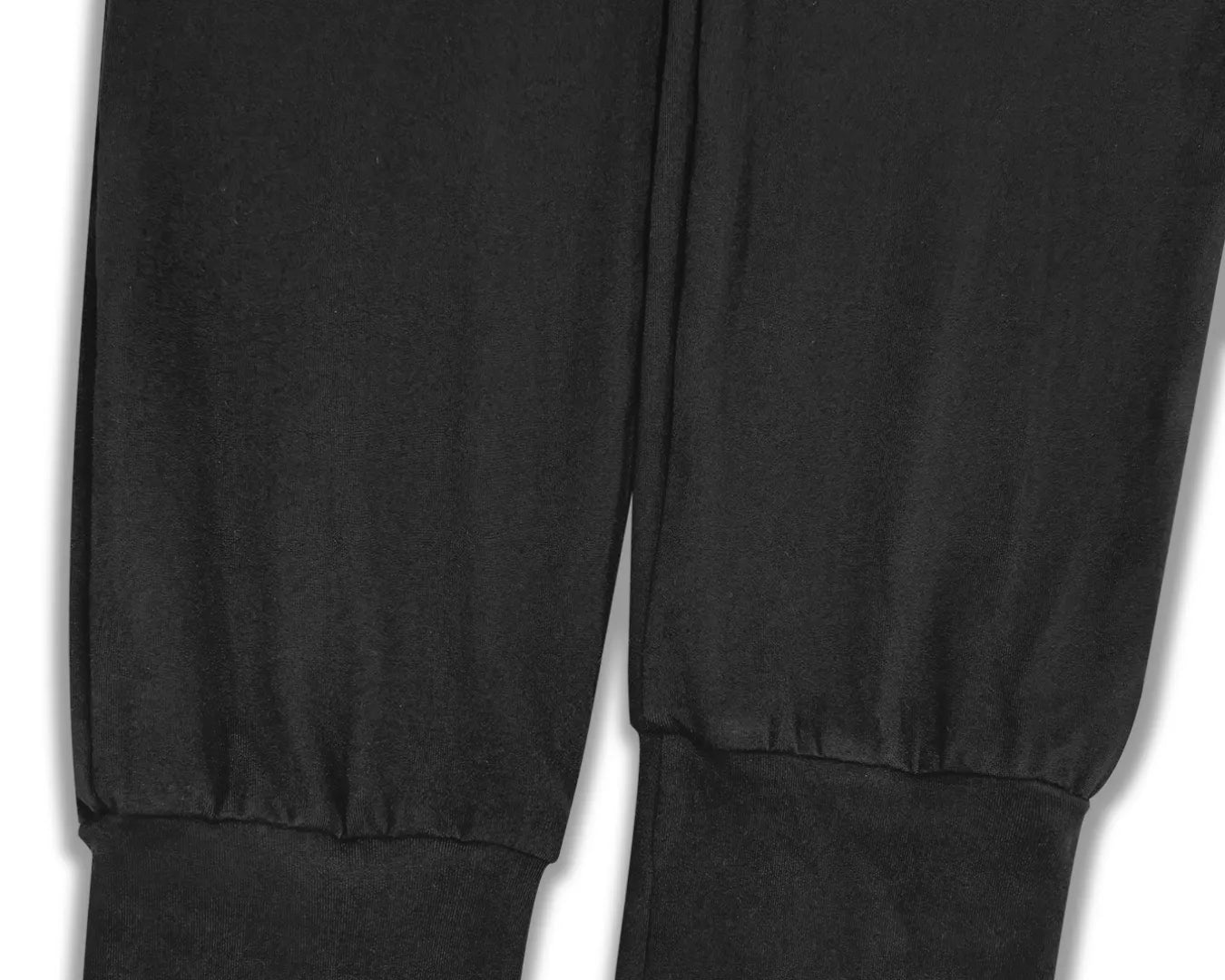 NEWYORKLISTED STYLE COLLECTION: Close-up of black pants with a white background