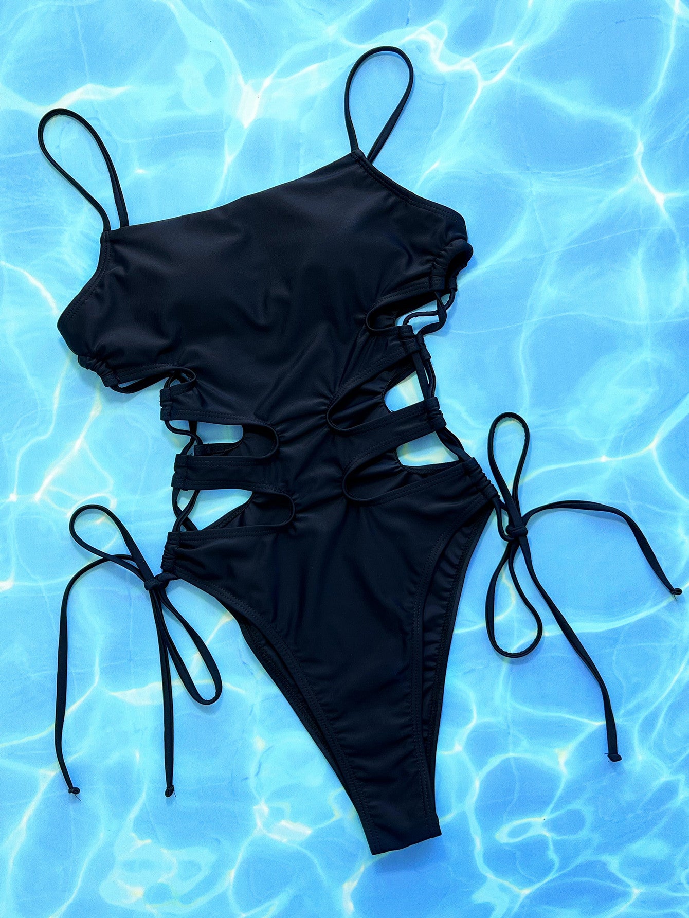 NEWYORKLISTED Eden Collection: Black bikini set on a blue water background