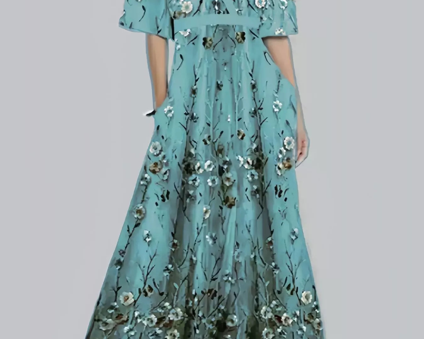 NEWYORKLISTED STYLE COLLECTION: Teal floral dress on a plain background