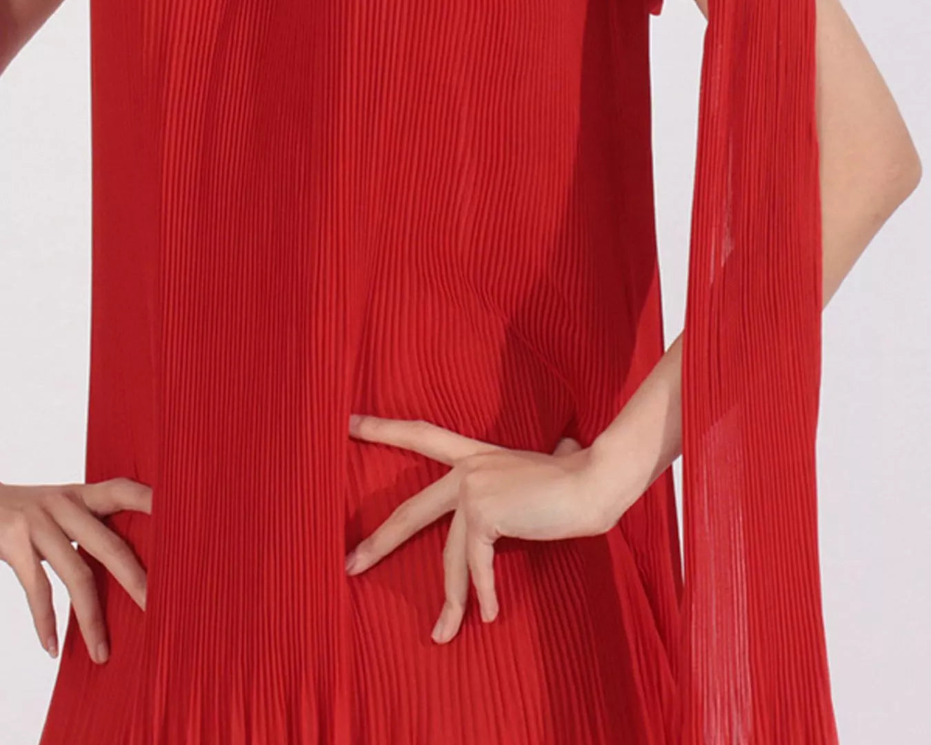 NEWYORKLISTED STYLE COLLECTION: Red off-shoulder dress with floral details on a white background