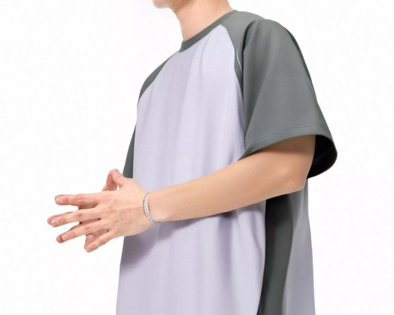 NEWYORKLISTED ATLAS MEN's COLLECTION: Person wearing a gray and white shirt with a cap and sunglasses on a white background