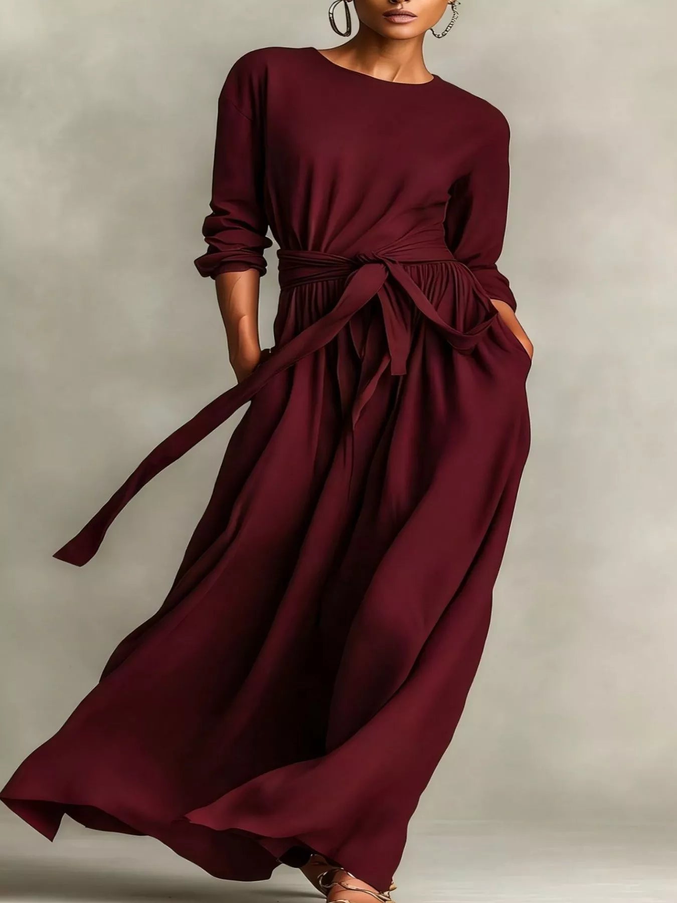 NEWYORKLISTED STYLE COLLECTION: Burgundy long-sleeve dress with a belt on a neutral background