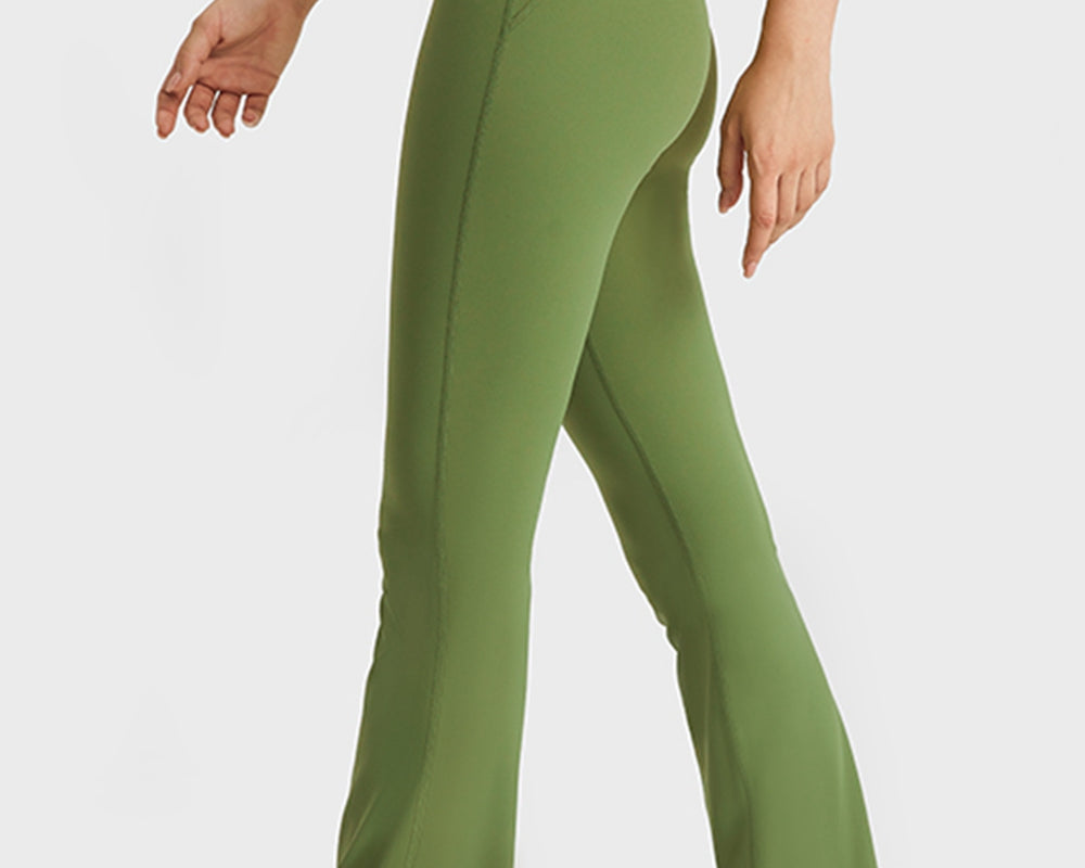 NEWYORKLISTED ACTIVEWEAR COLLECTION: Green flared pants worn by a person on a white background