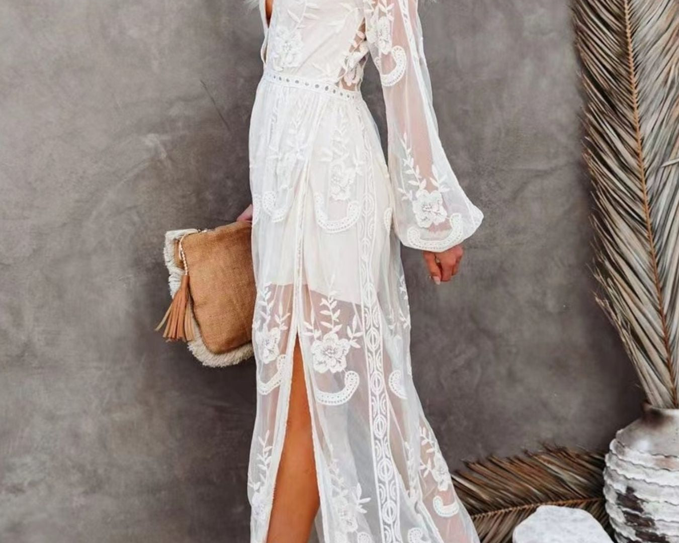 NEWYORKLISTED STYLE COLLECTION: Woman wearing a white lace dress with a gray background