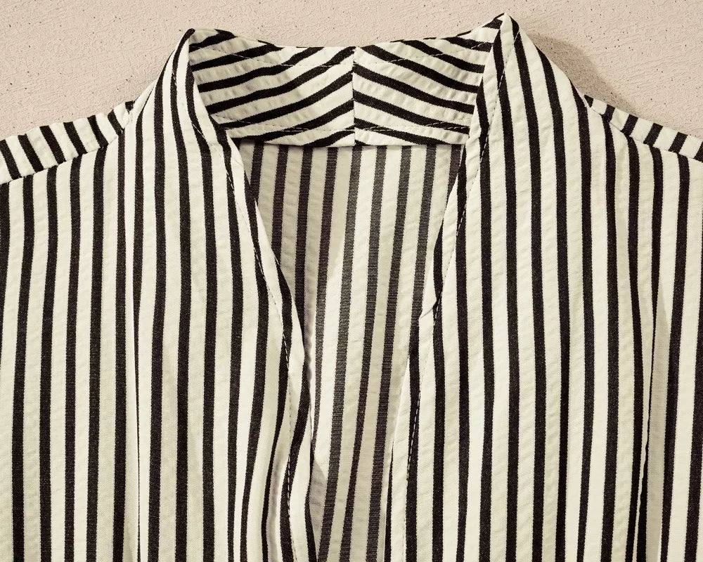 NEWYORKLISTED STYLE COLLECTION: Black and white striped shirt on a beige background