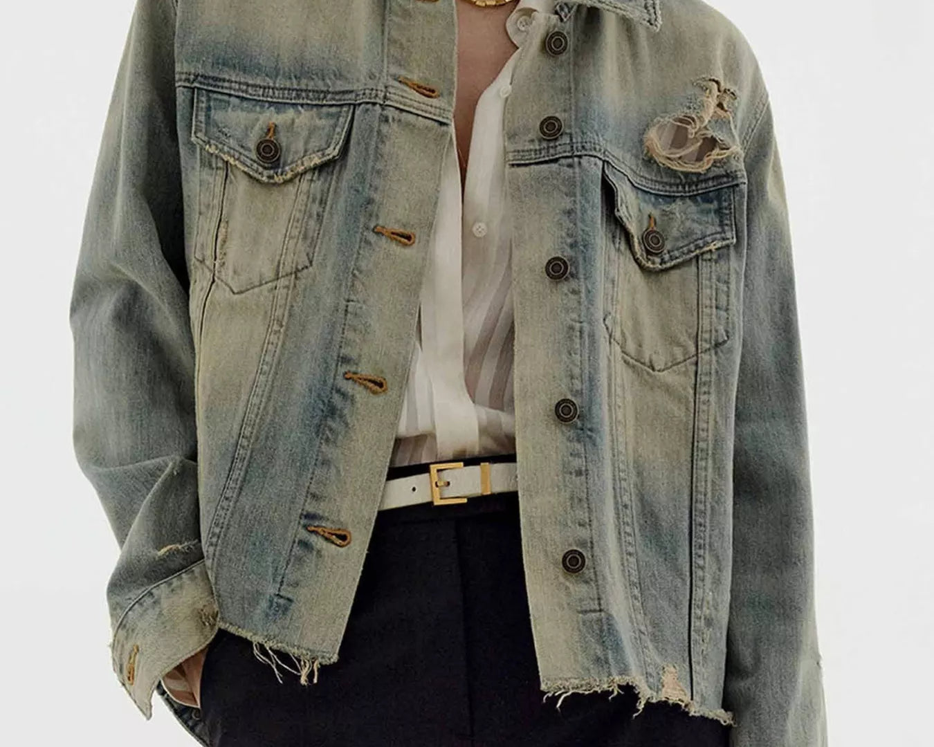 NEWYORKLISTED STYLE COLLECTION: Person wearing a light blue denim jacket on a white background