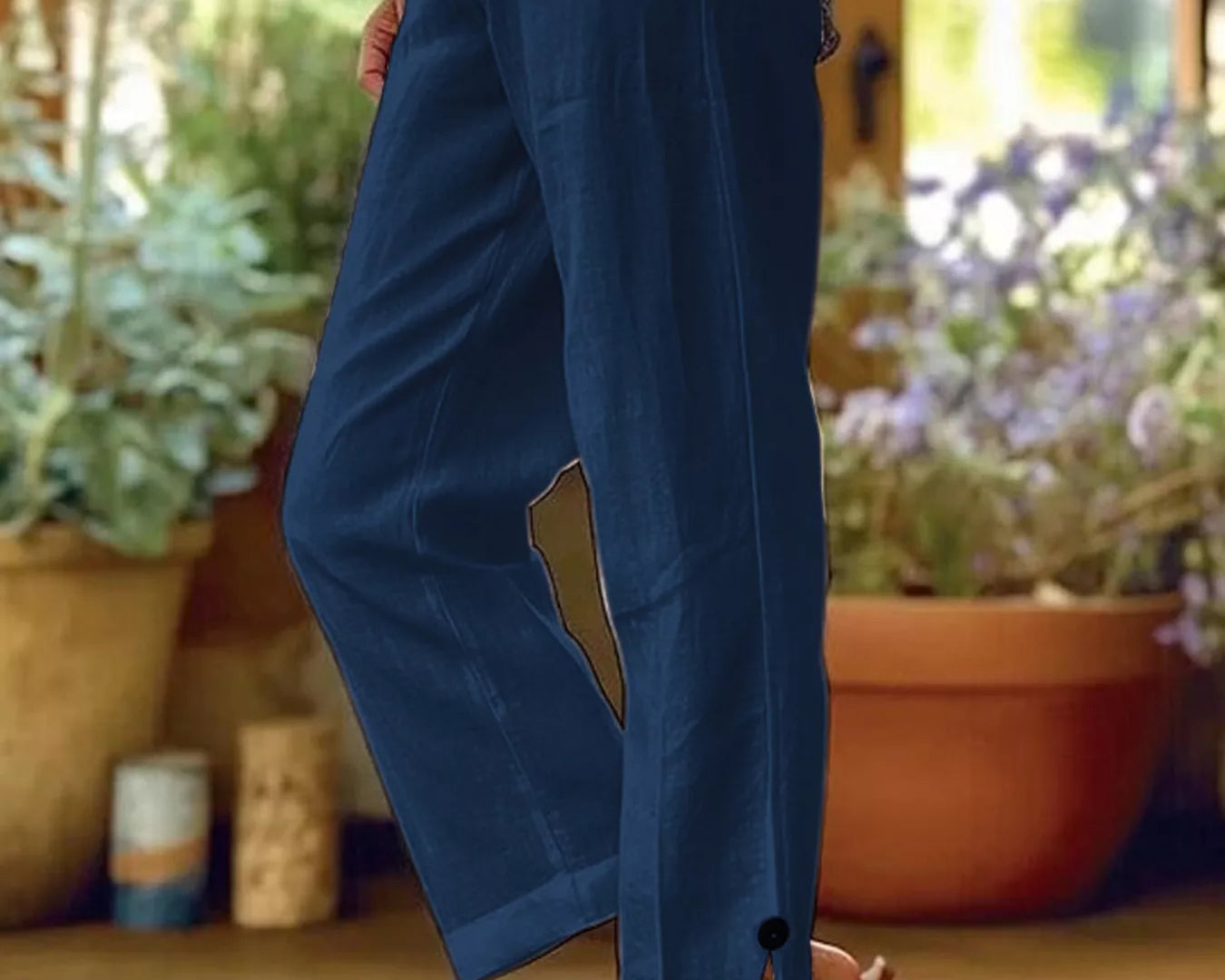 NEWYORKLISTED STYLE COLLECTION: Person wearing blue pants with a blurred indoor background