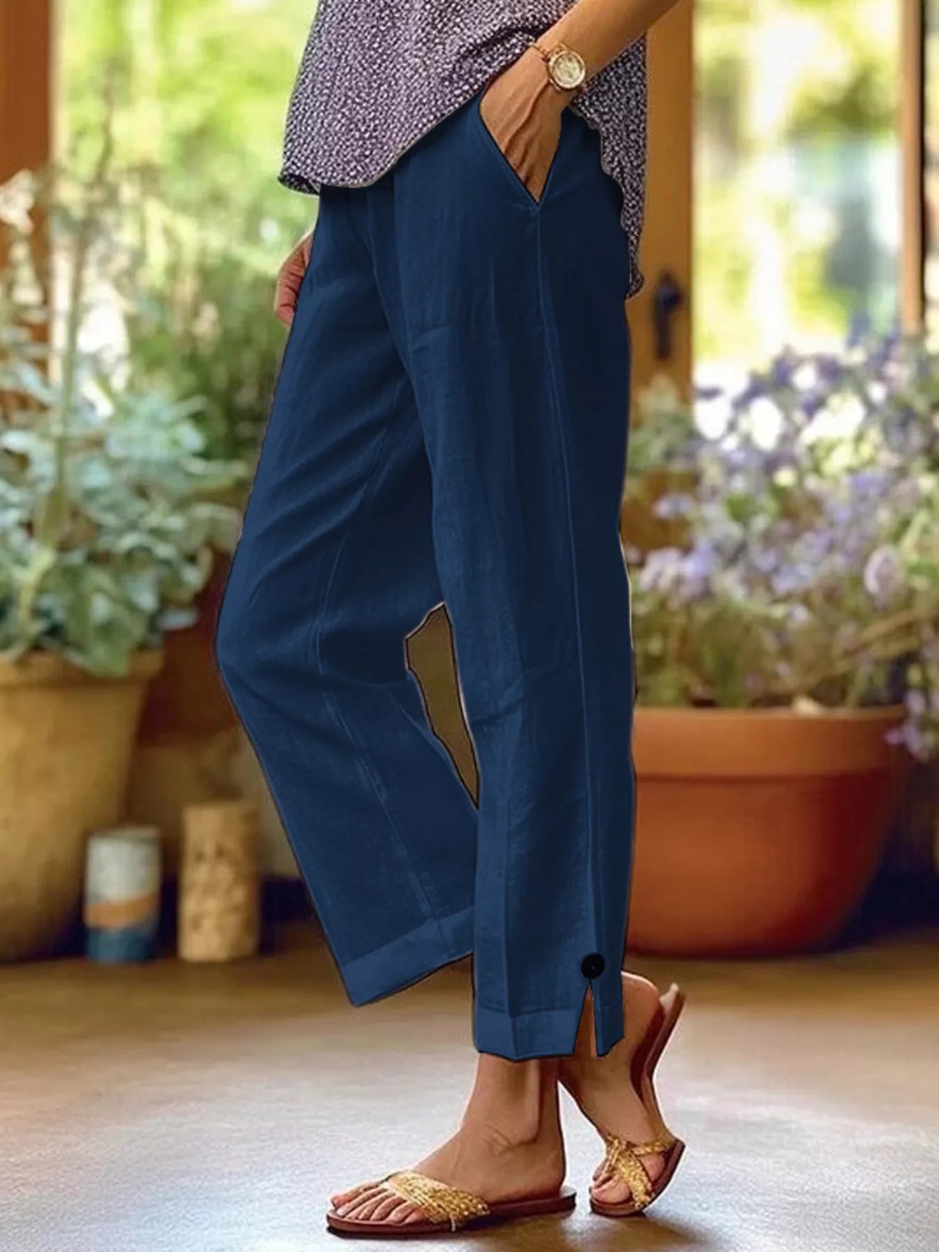 NEWYORKLISTED STYLE COLLECTION: Person wearing blue pants with a blurred indoor background