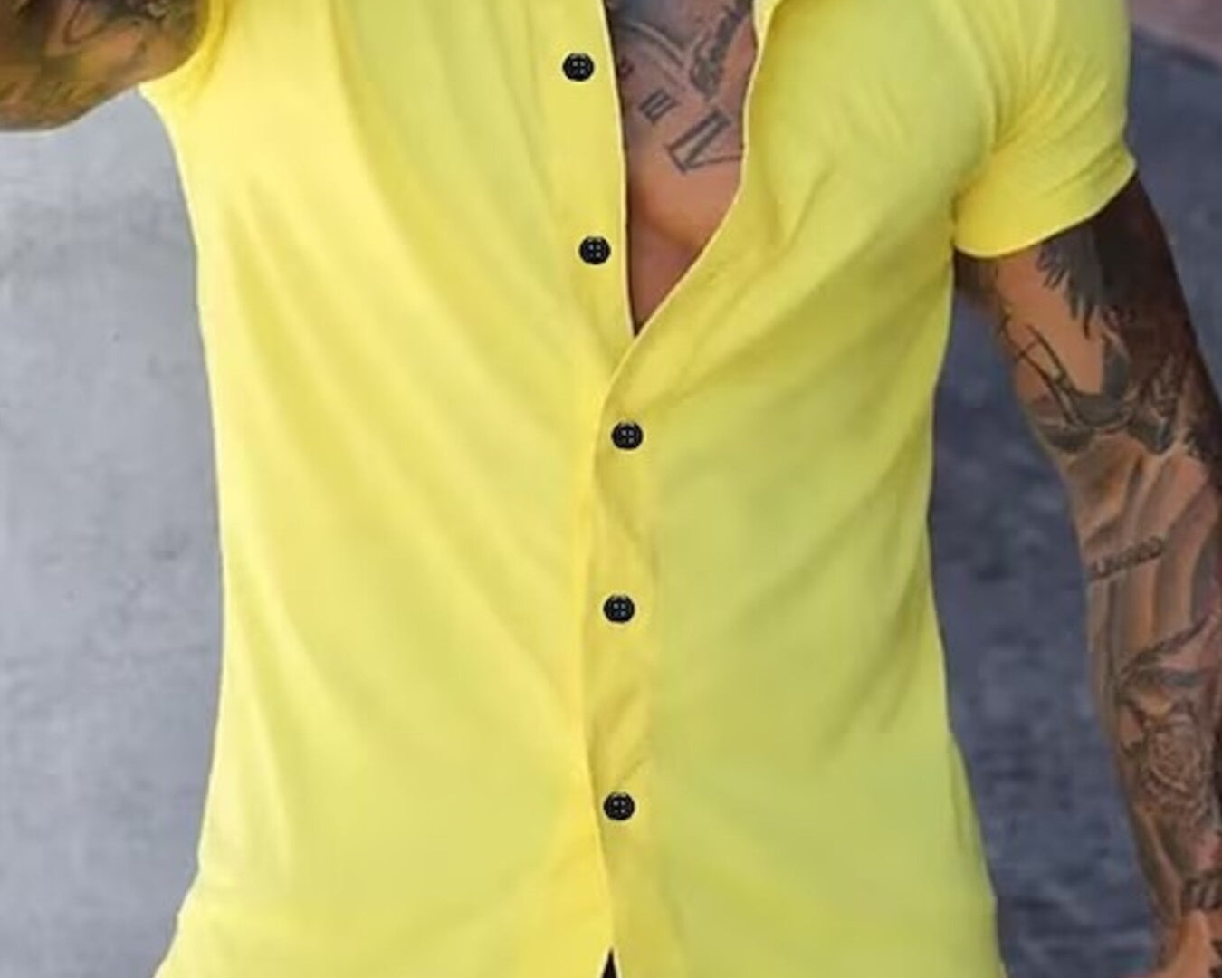 NEWYORKLISTED ATLAS MEN's COLLECTION: Person wearing a yellow button-up shirt with tattoos on arms and neck.