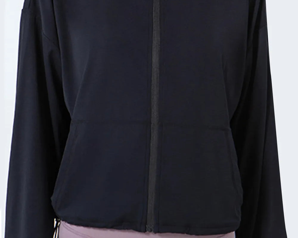 NEWYORKLISTED ACTIVEWEAR COLLECTION: Black jacket worn by a person on a white background