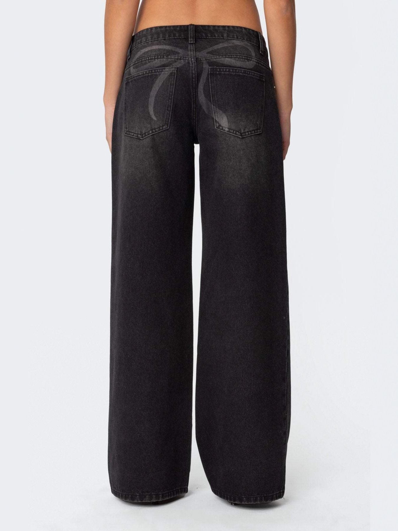 NEWYORKLISTED STYLE COLLECTION: Black wide-leg jeans on a white background