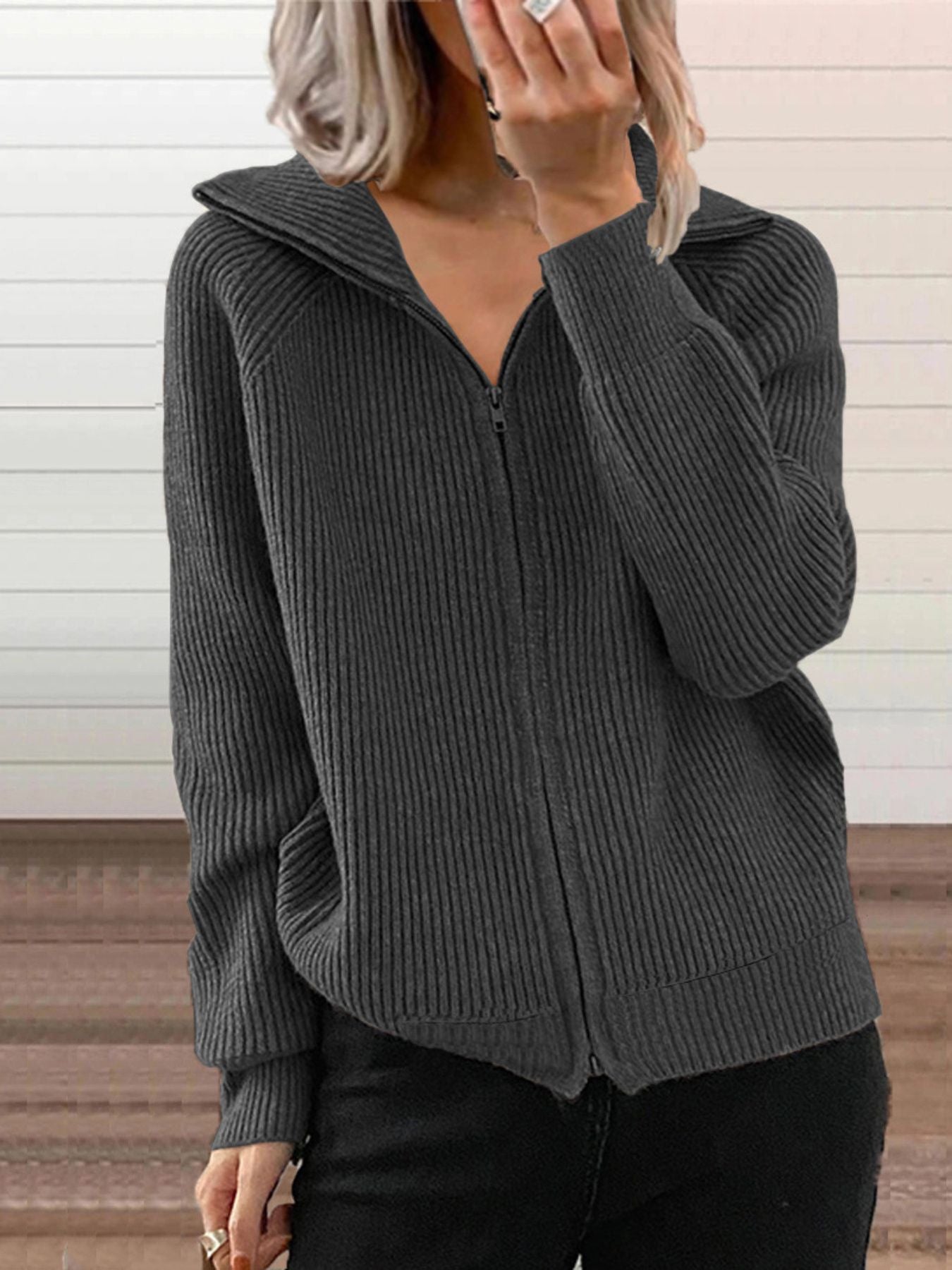NEWYORKLISTED STYLE COLLECTION: Person wearing a gray ribbed zip-up hoodie against a neutral background