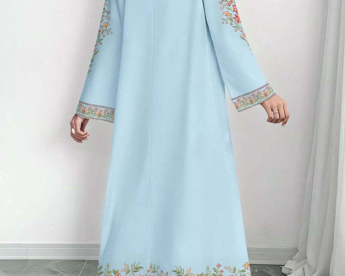 NEWYORKLISTED STYLE COLLECTION: Light blue dress with floral embroidery on a white background