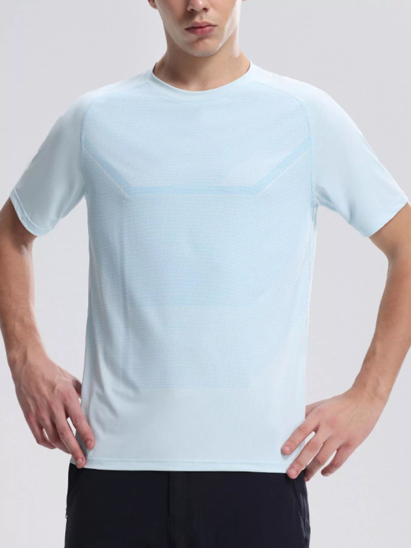 NEWYORKLISTED ATLAS MEN'S COLLECTION: Person wearing a light blue t-shirt against a plain background