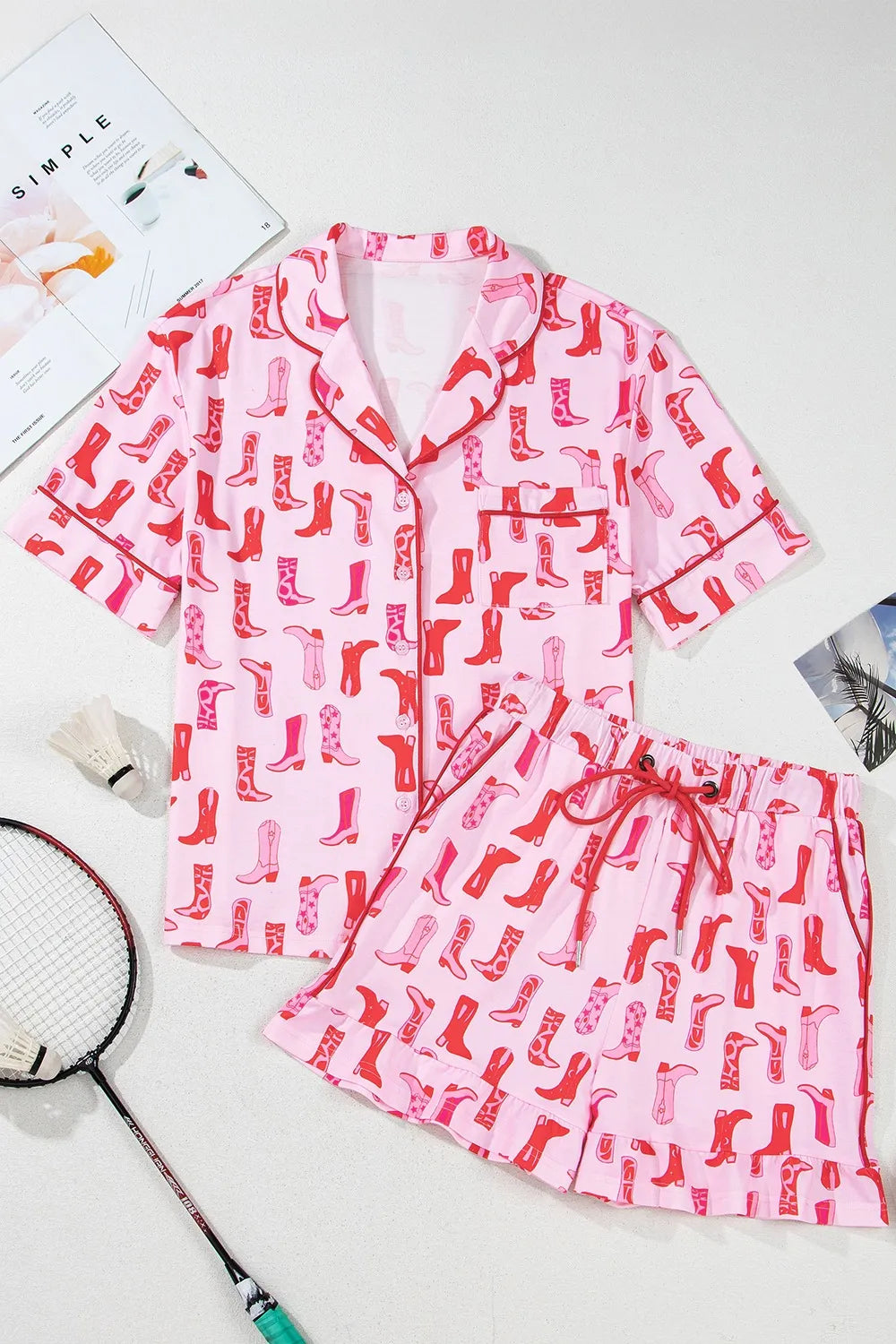 NEWYORKLISTED Intimate Apparel: Pink pajama set with red boot pattern on a white background