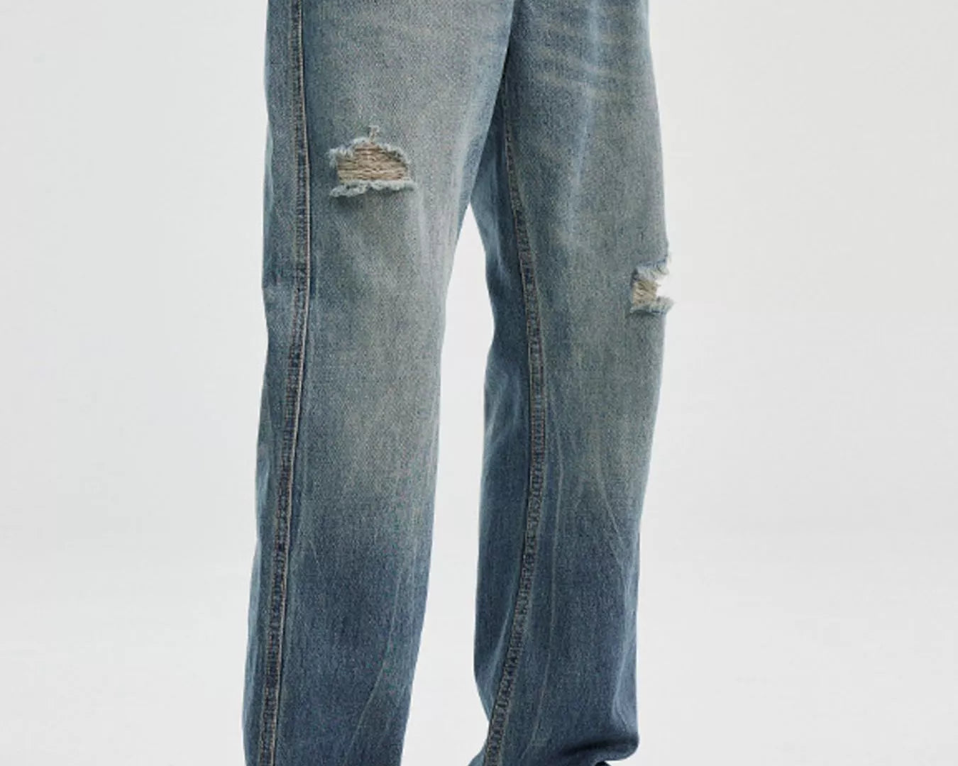 NEWYORKLISTED ATLAS MEN's COLLECTION: Person wearing distressed blue jeans and a checkered shirt on a white background