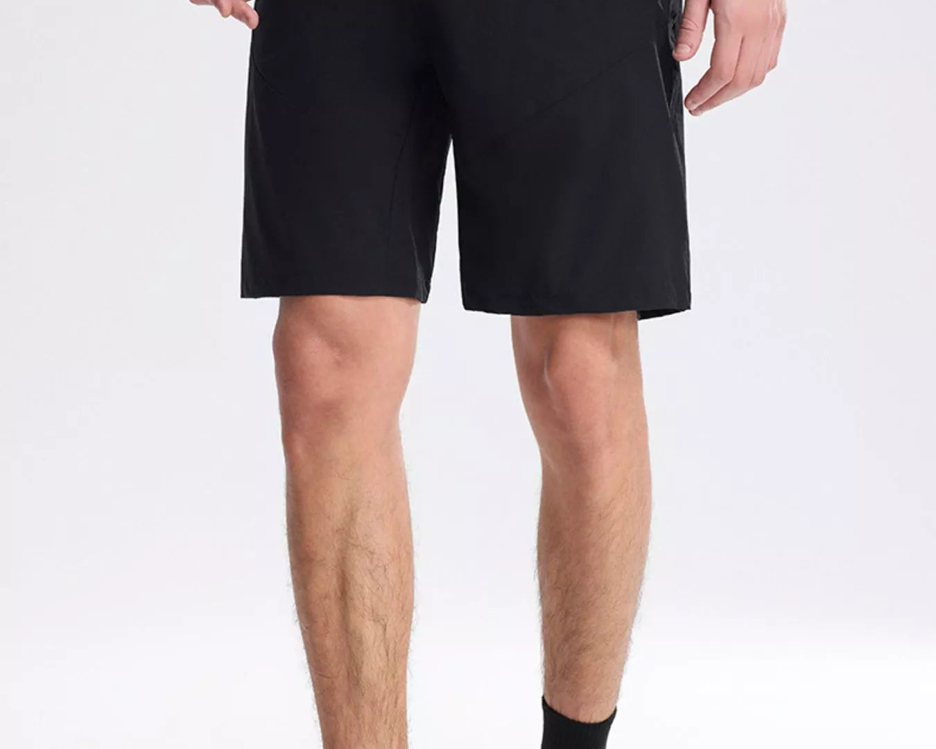 NEWYORKLISTED ATLAS MEN's COLLECTION: Person wearing black shorts on a white background