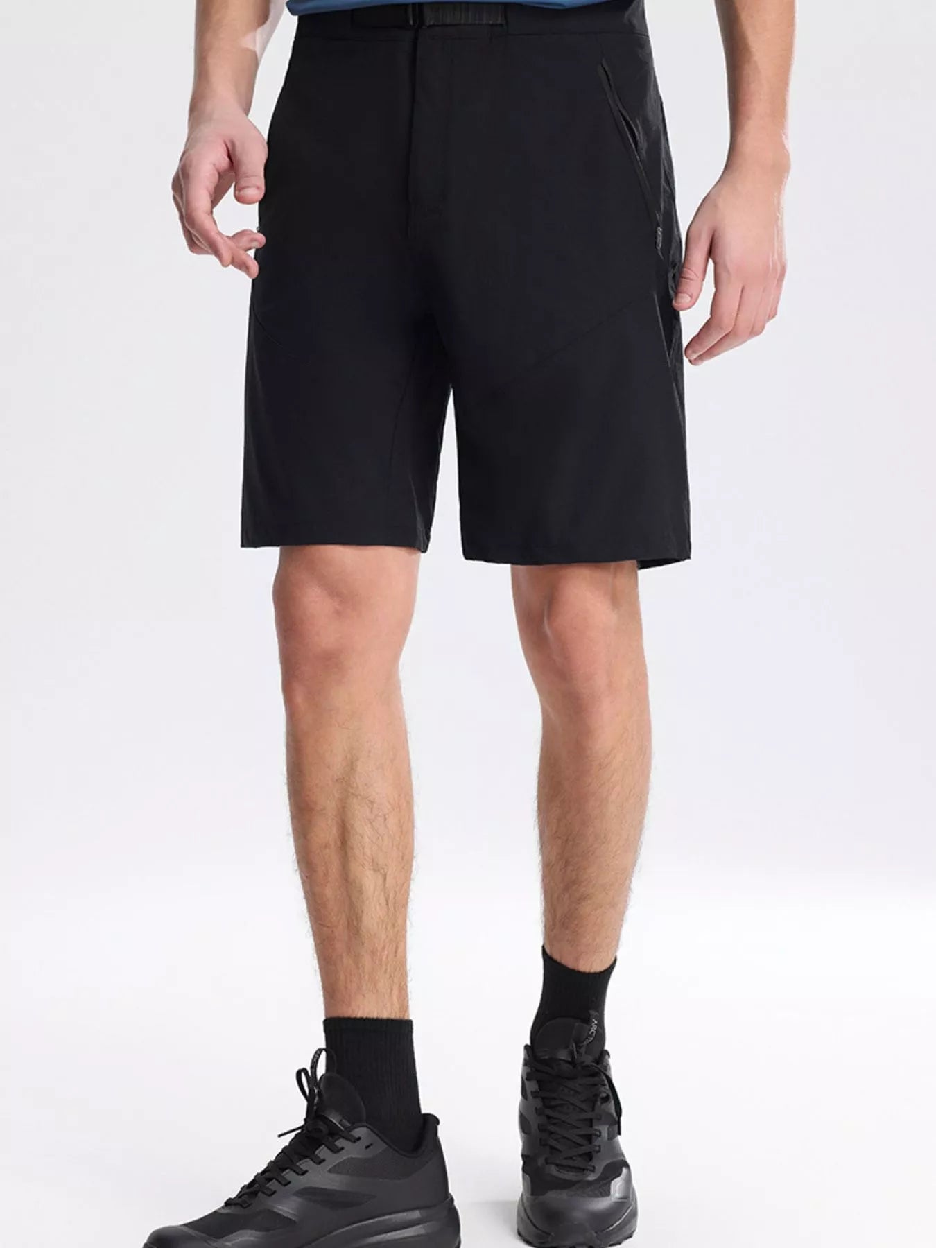 NEWYORKLISTED ATLAS MEN's COLLECTION: Person wearing black shorts on a white background