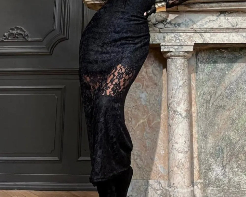 NEWYORKLISTED Valentine's Day Specials: Person wearing a black lace dress standing against a decorative wall.
