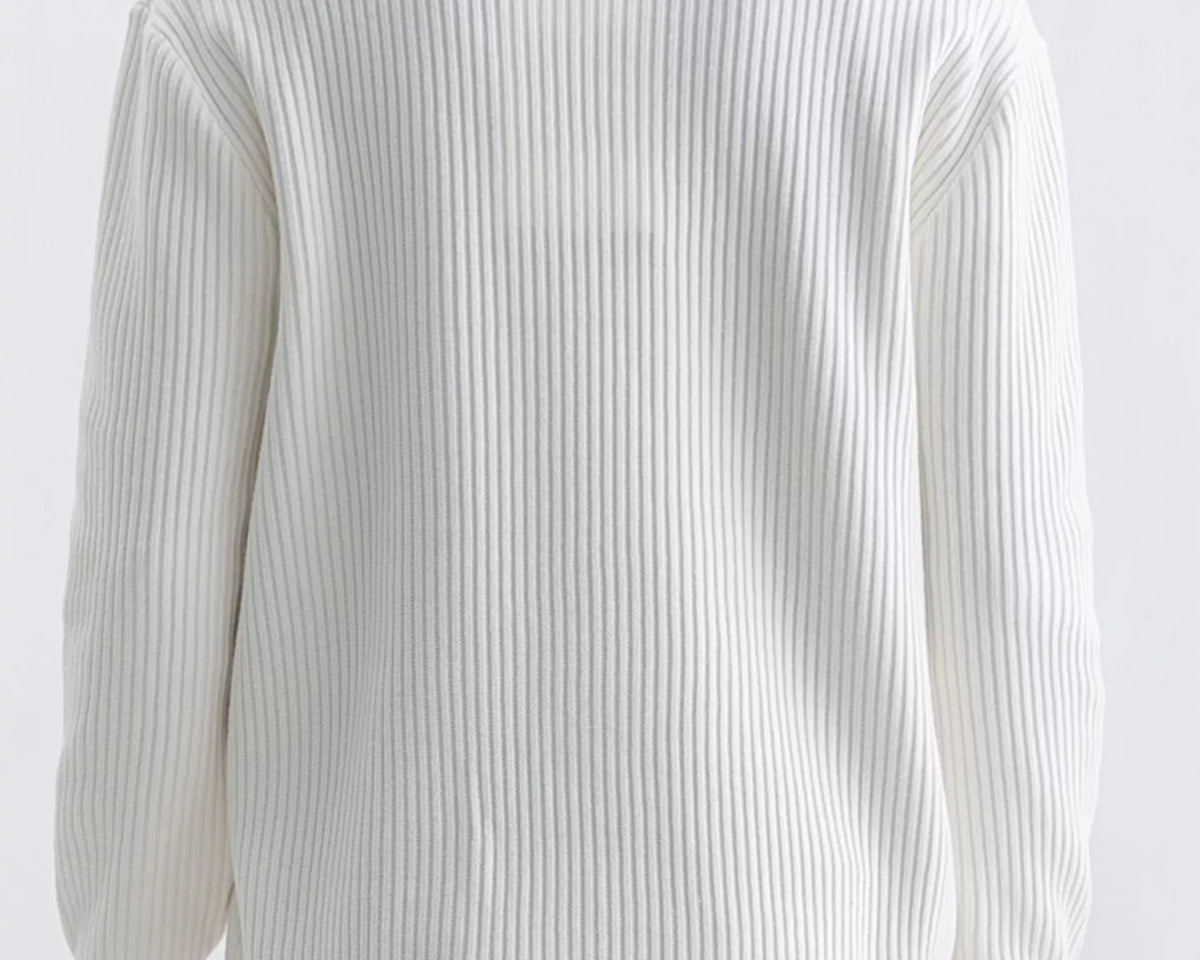 NEWYORKLISTED ATLAS MEN'S COLLECTION: A person shown from the back wearing a ribbed knit long-sleeve sweater in off-white, paired with beige pants, against a plain light background.