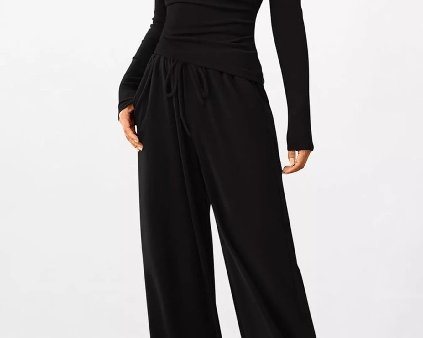 Black long-sleeve jumpsuit on a white background