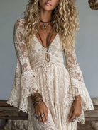 NEWYORKLISTED STYLE COLLECTION: Woman wearing a lace dress with long sleeves and layered necklaces.