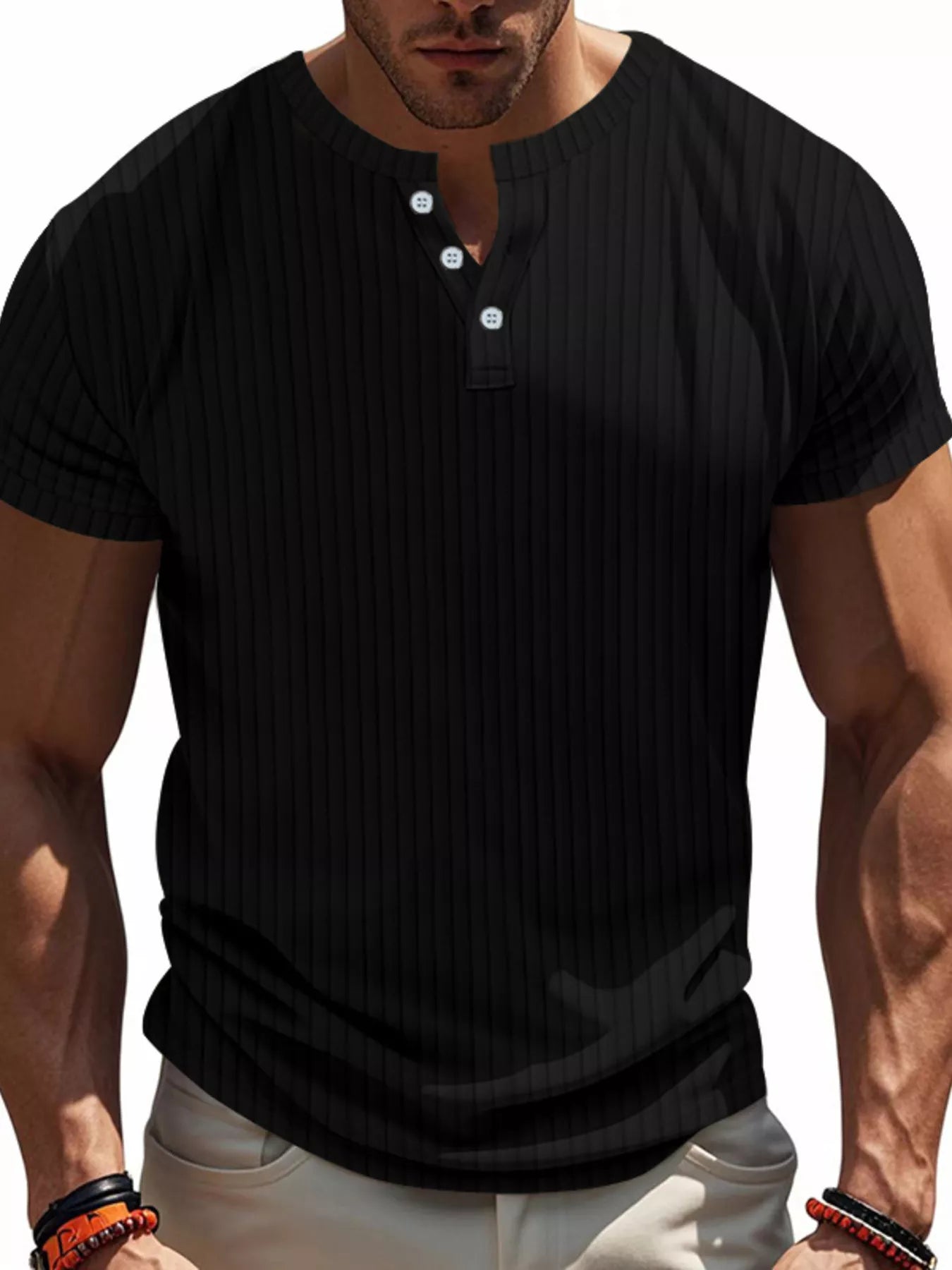 NEWYORKLISTED ATLAS MEN'S COLLECTION: Man wearing a black short-sleeve henley shirt on a white background