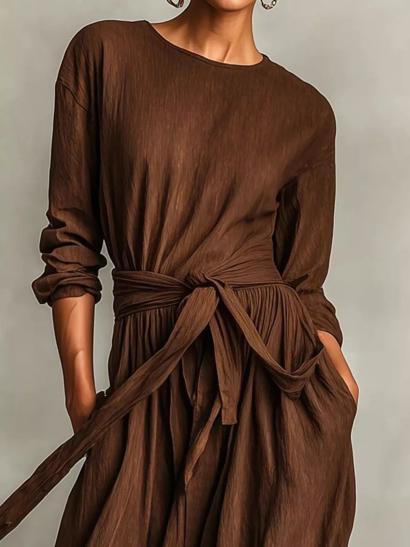 NEWYORKLISTED STYLE COLLECTION: Brown dress with a belt on a plain background