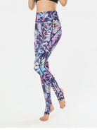 NEWYORKLISTED ACTIVEWEAR COLLECTION: Multicolored patterned leggings worn by a person on a white background