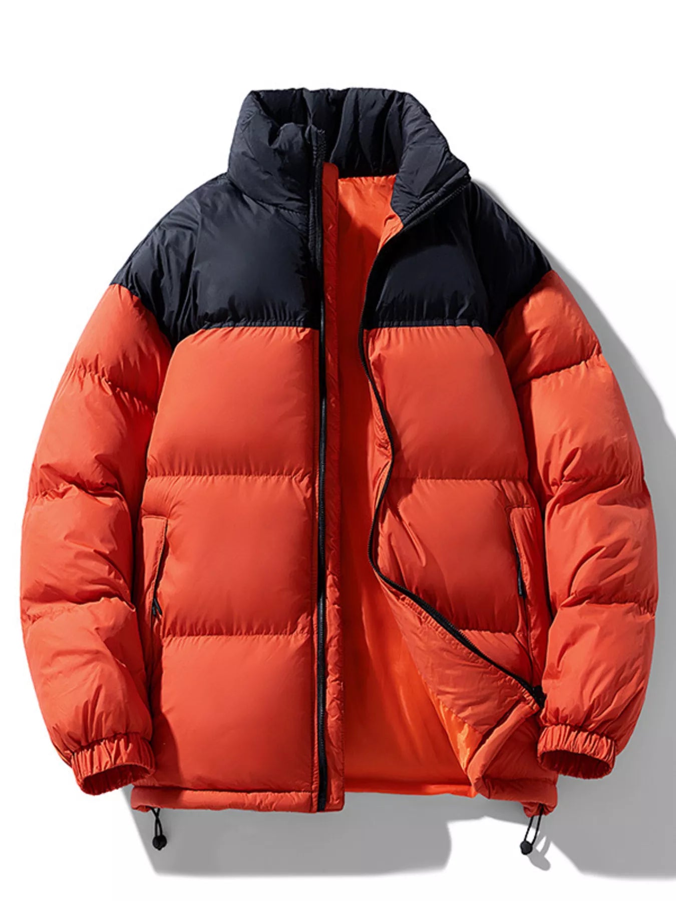 NEWYORKLISTED ATLAS MEN’S COLLECTION: Orange red and black puffer jacket on a white background