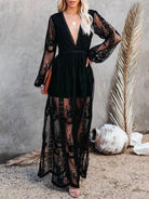 NEWYORKLISTED STYLE COLLECTION: Woman wearing a black lace dress with sheer panels against a neutral background