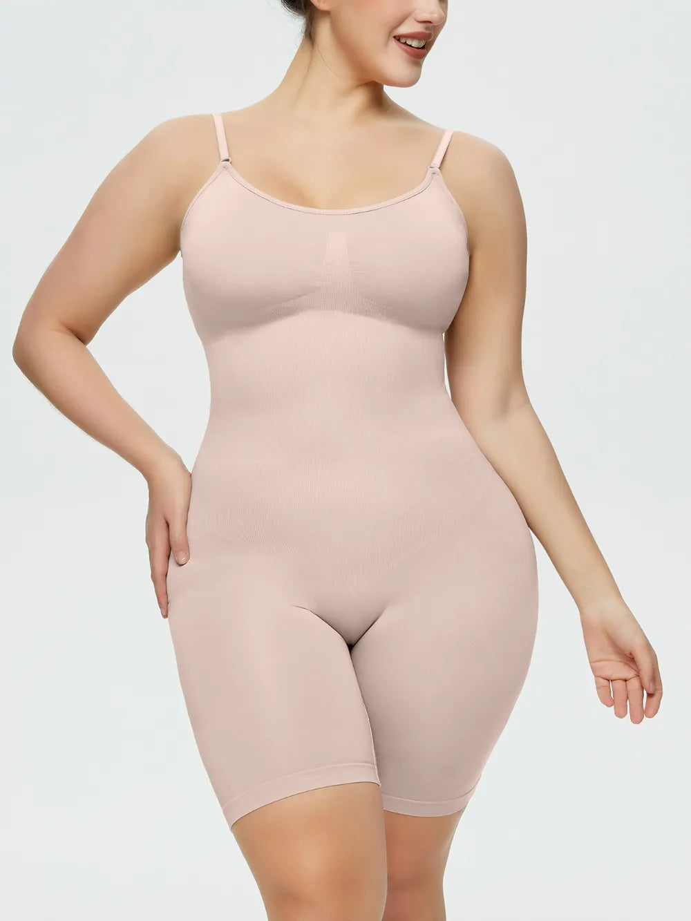 NEWYORKLISTED Intimate Apparel Collection: Woman wearing a beige shapewear bodysuit on a white background
