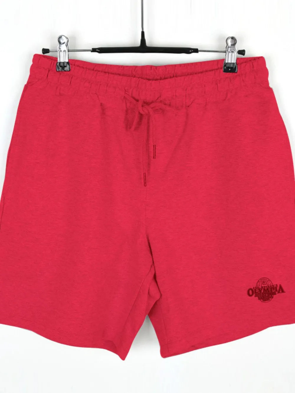 NEWYORKLISTED ATLAS MEN's COLLECTION: Red shorts with a logo on a hanger against a white background