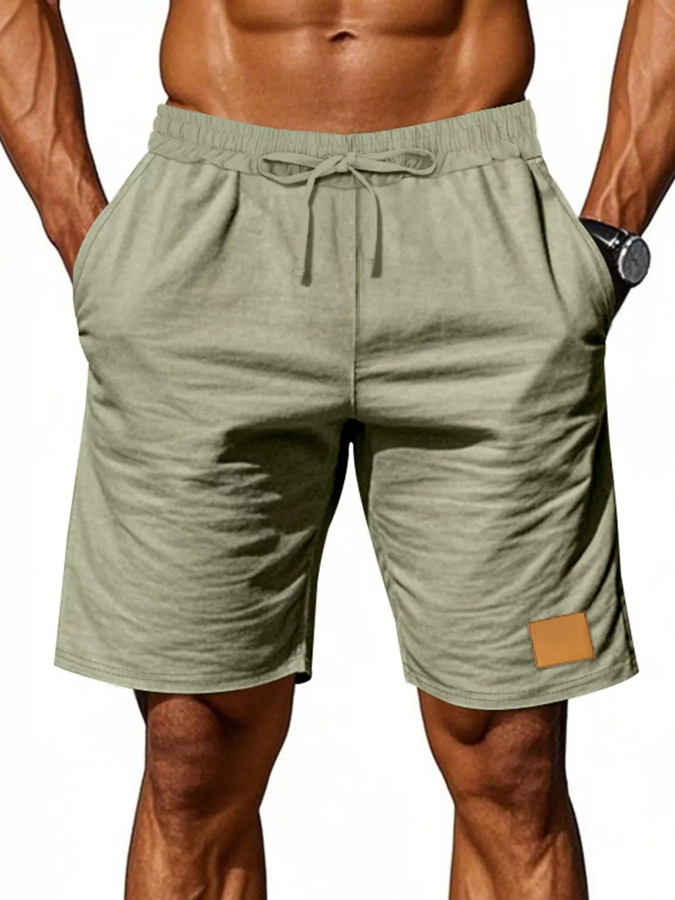 NEWYORKLISTED ATLAS MEN'S COLLECTION: Green shorts with a drawstring on a white background