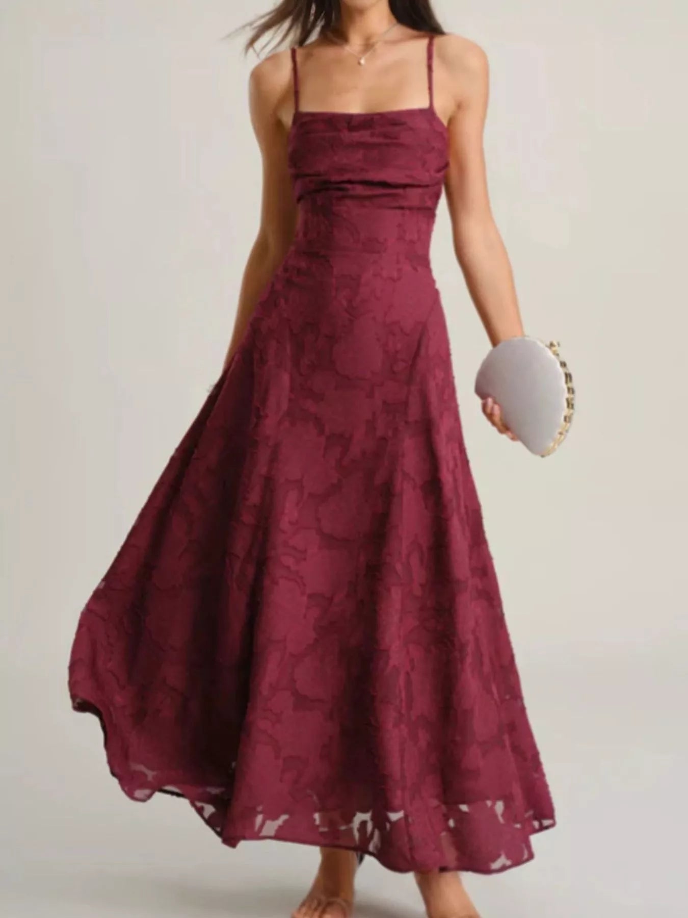 NEWYORKLISTED STYLE COLLECTION: Maroon lace dress worn by a person on a plain background