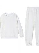 NEWYORKLISTED COMFORT COLLECTION: White long-sleeve shirt and pants set on a white background