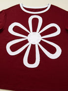 NEWYORKLISTED STYLE COLLECTION: Red shirt with a white flower design on a beige background