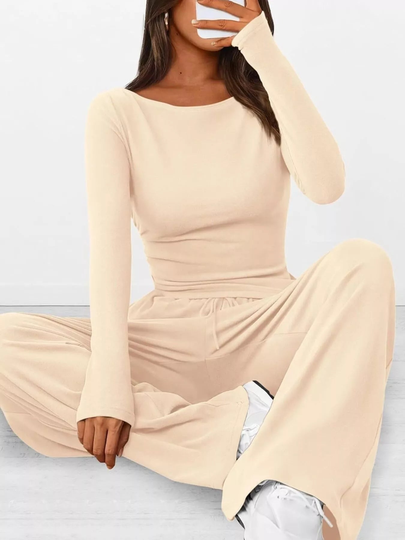 NEWYORKLISTED COMFORT COLLECTION: Long Sleeve Top and Wide Leg Pants Set: Beige long-sleeve top and wide-leg pants set on a light gray background