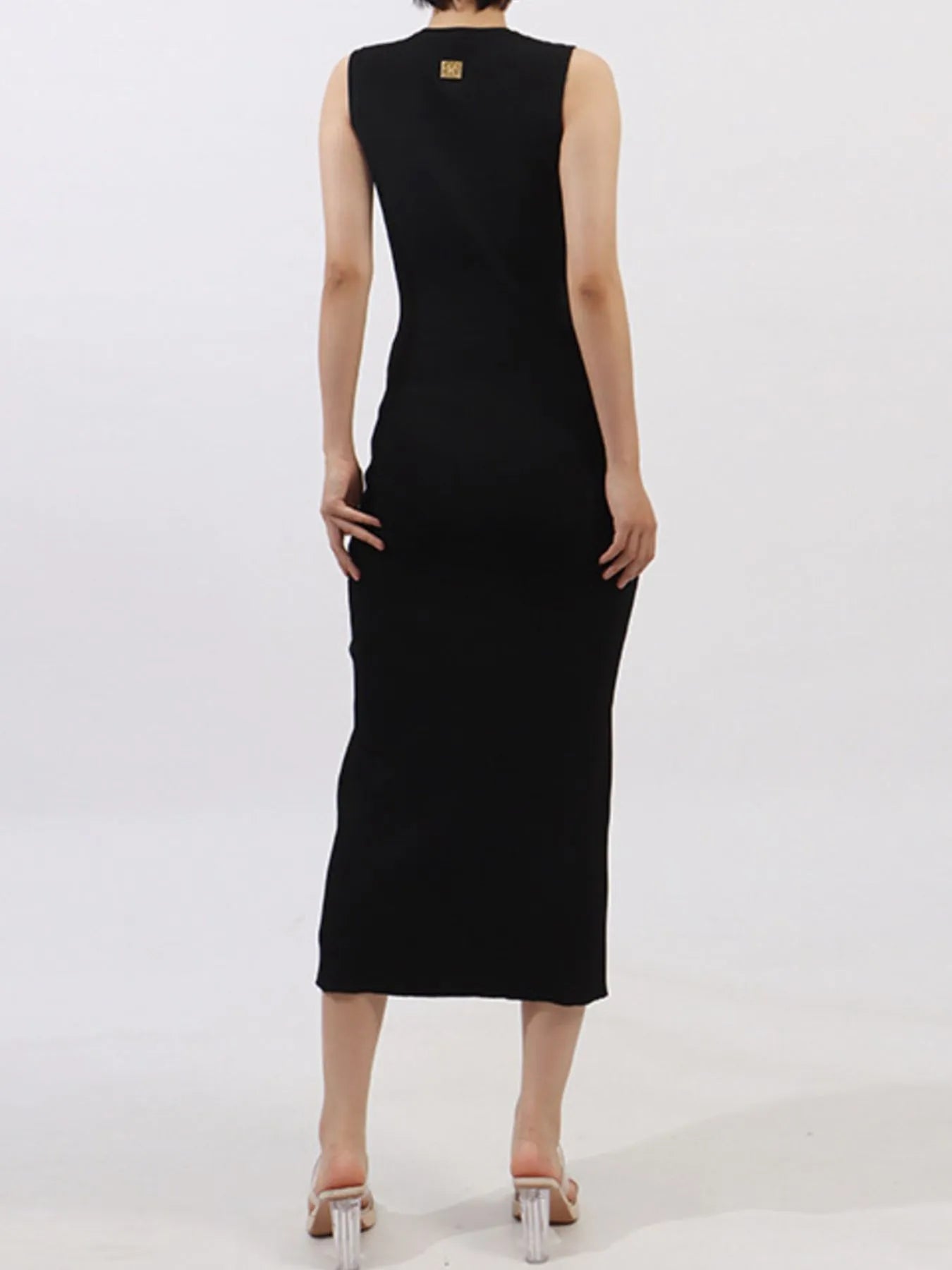 NEWYORKLISTED RUNWAY STYLE: Black sleeveless dress on a white background