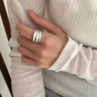 NYLD Glamour Collection: Model is wearing sterling silver modern design ring.