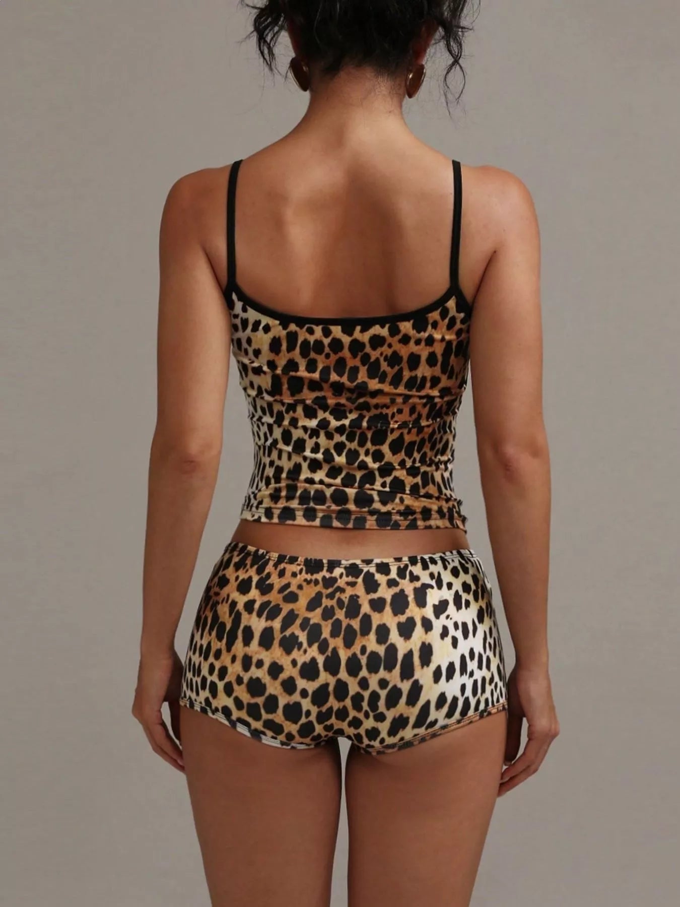 NEWYORKLISTED INTIMATE APPAREL COLLECTION: Leopard print lingerie set on a plain background