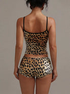 NEWYORKLISTED INTIMATE APPAREL COLLECTION: Leopard print lingerie set on a plain background