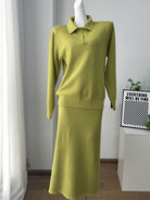 NEWYORKLISTED Comfort Collection: Green sweater and skirt set on a mannequin against a white wall.