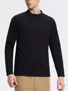 NEWYORKLISTED ATLAS MEN's COLLECTION: Person wearing a black long-sleeve shirt on a white background