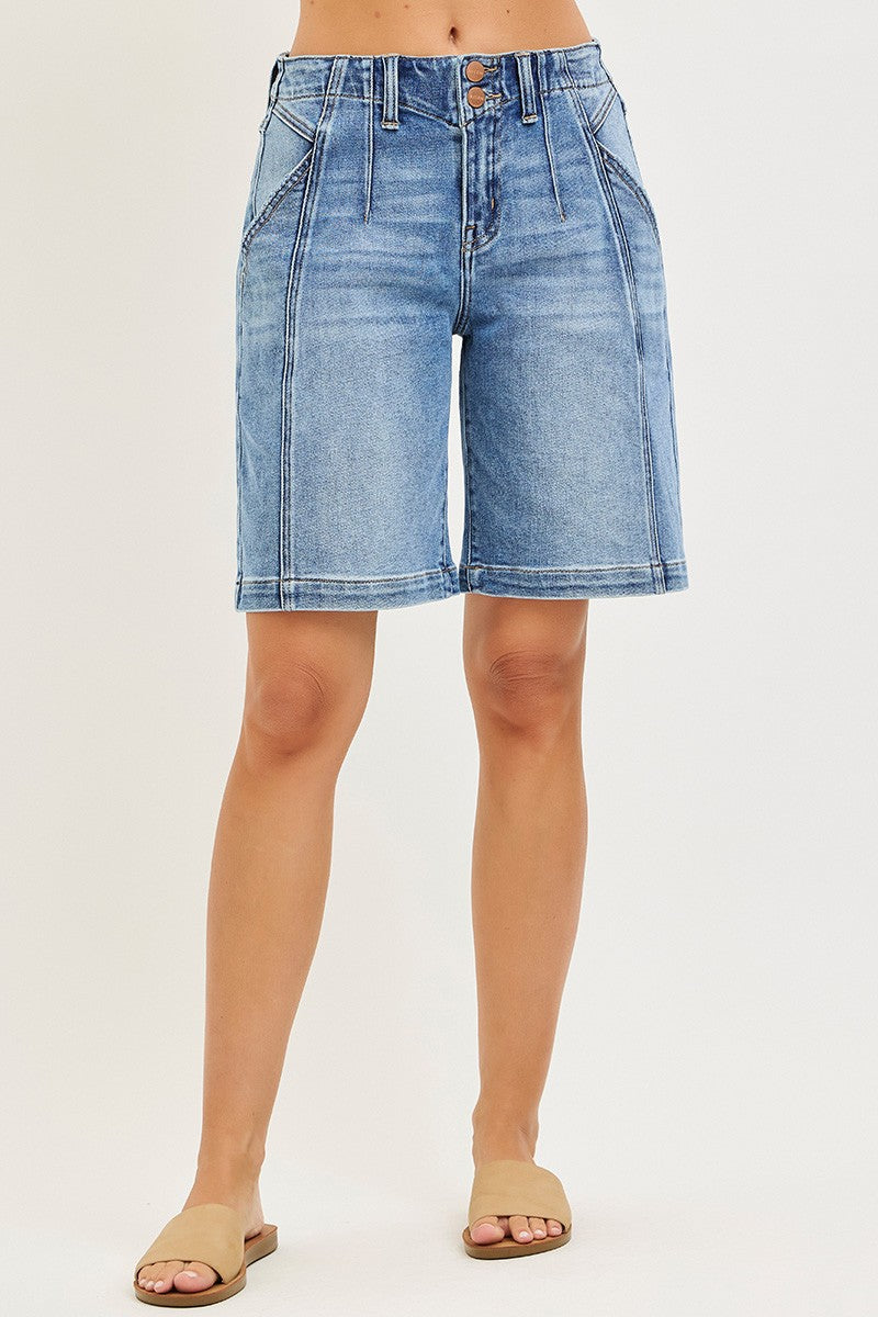 NEWYORKLISTED STYLE COLLECTION: Denim shorts worn by a person on a plain background