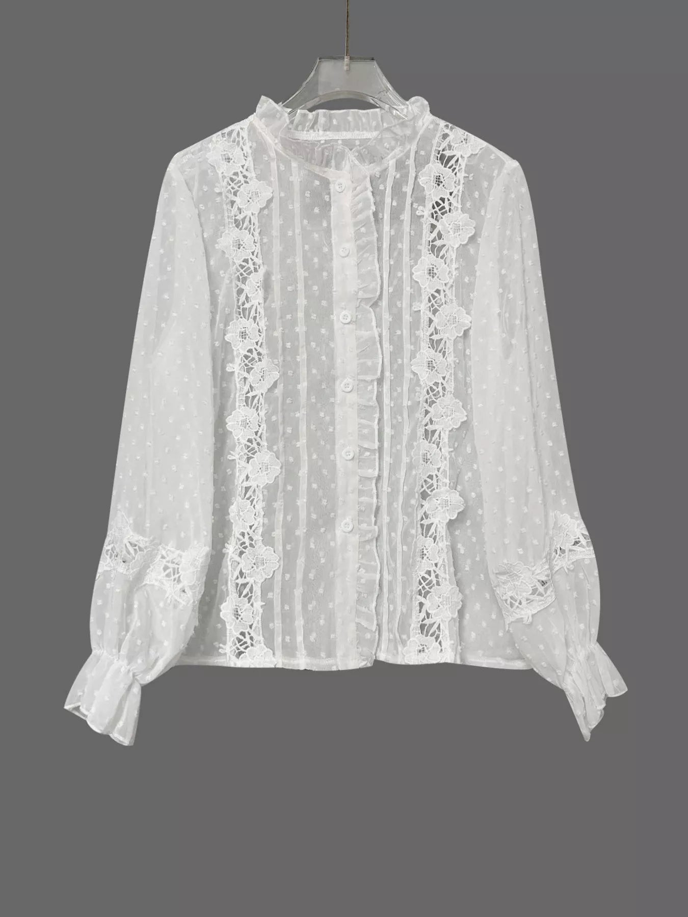 NEWYORKLISTED STYLE COLLECTION: White lace blouse on a hanger against a gray background